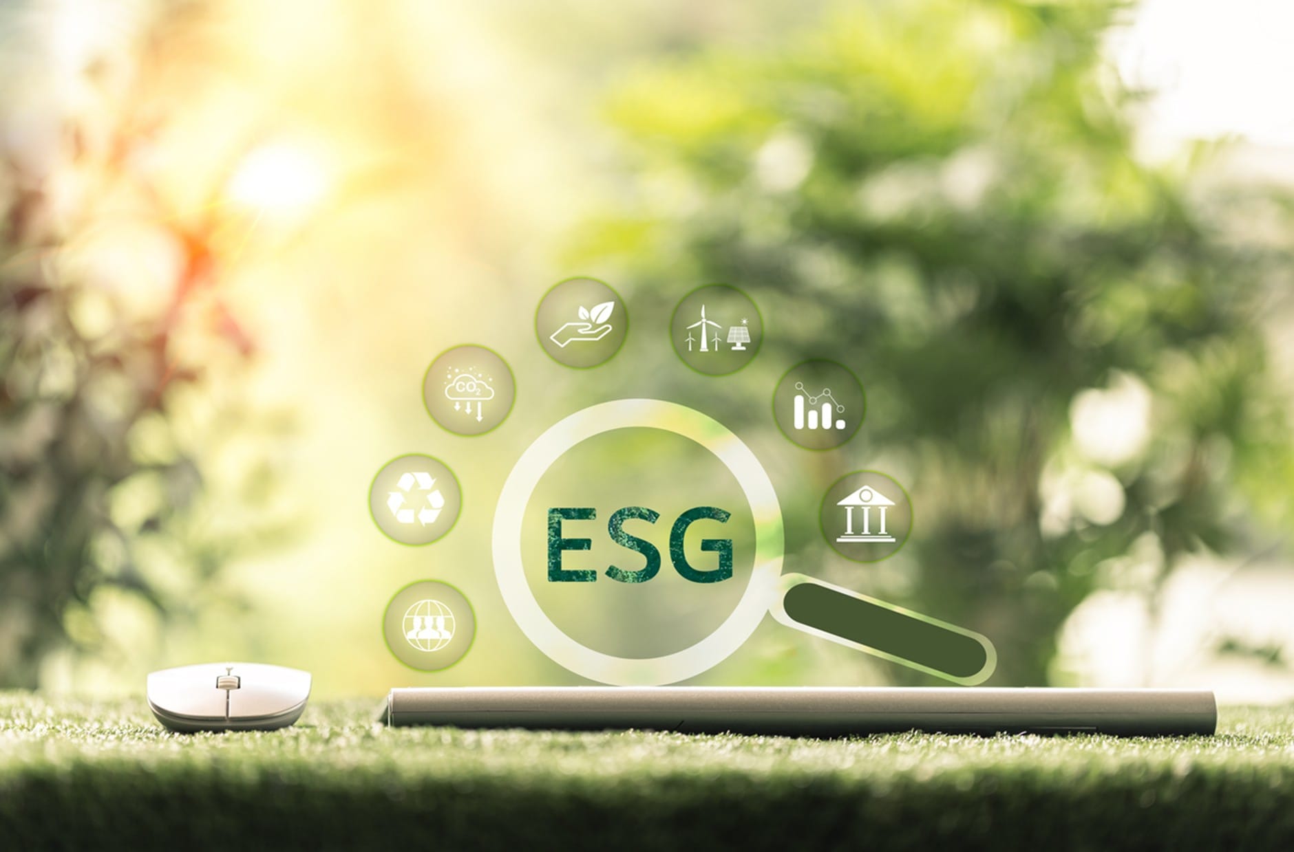 A green ESG magnifying lens over sustainability symbols, highlighting environmental, social and governance themes against a soft natural background.